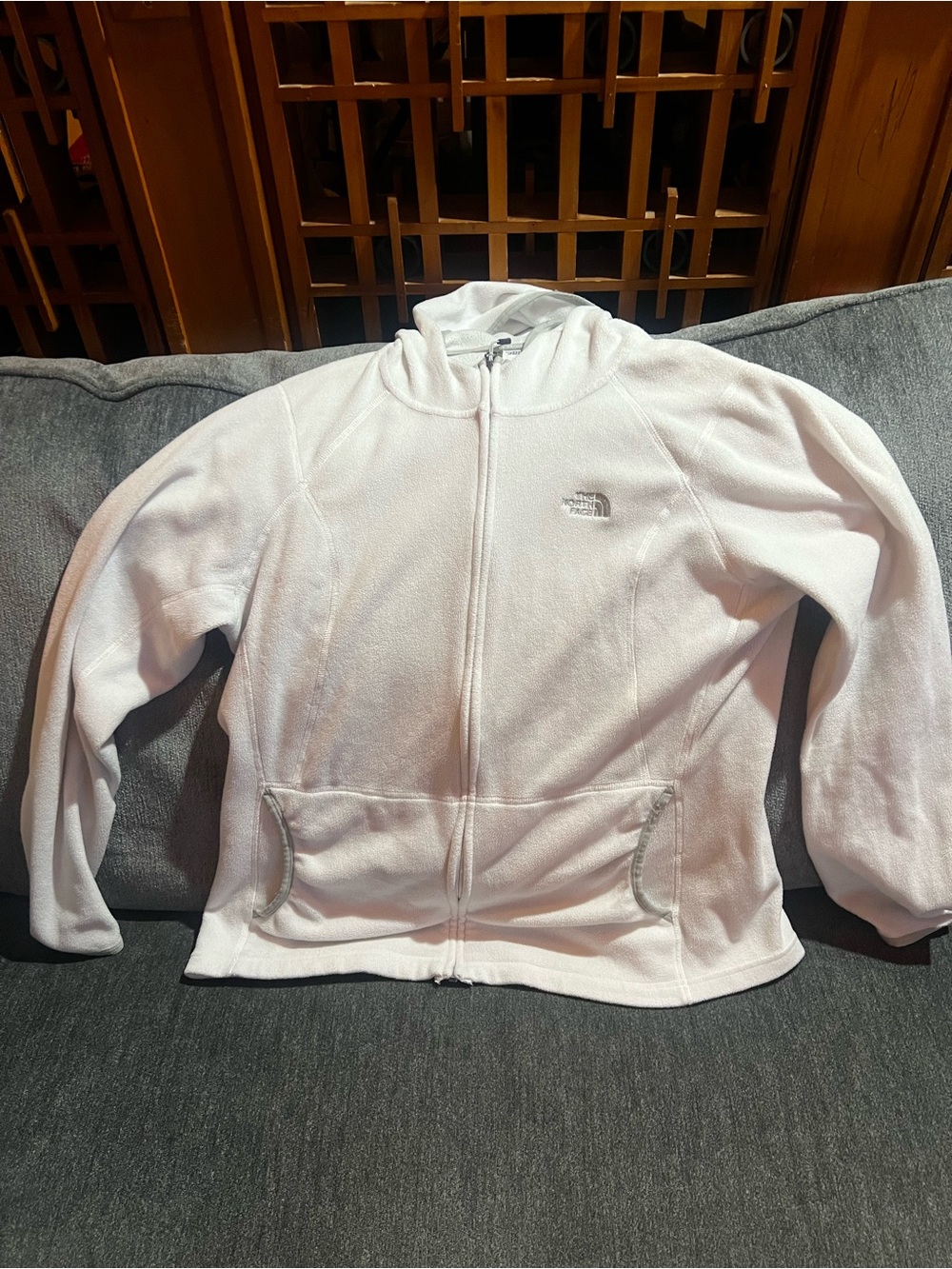The North Face White women’s Hooded Fleece Jacket